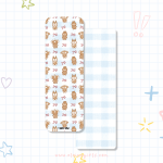 Christmas bookmark with gingerbread Elaine Girls characters and bows on a blue gingham background