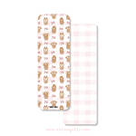 Christmas bookmark with gingerbread Elaine Girls characters and bows on a pink gingham background