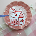 Strawberry Milk Carton vinyl sticker featuring a pink strawberry milk carton with strawberries and a striped straw by Elaine Girls