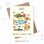 Dad You’re a Reel One Father’s Day greeting card featuring colorful illustrated fish and stars by Elaine Girls