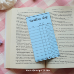Blue reading log bookmark with spaces to track book titles, start and end dates, and star ratings by Elaine Girls