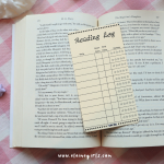 Yellow reading log bookmark with spaces to track book titles, start and end dates, and star ratings by Elaine Girls