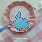 Whale Shark vinyl sticker featuring a cute light blue whale shark with white spots and a happy open-mouth expression by Elaine Girls