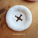 White crochet button coaster with brown stitched button detail by Elaine Girls