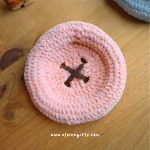 Pink crochet button coaster with brown stitched button detail by Elaine Girls